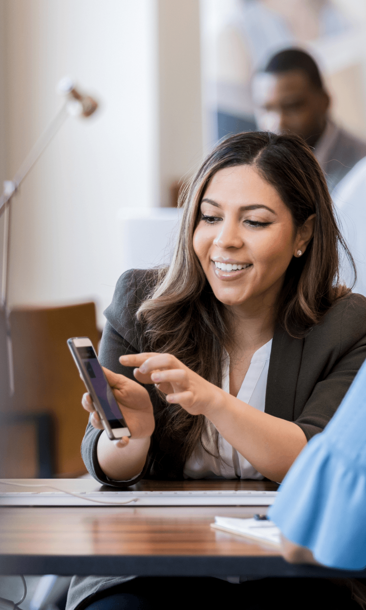 Bank customer using a smartphone to check a sort code